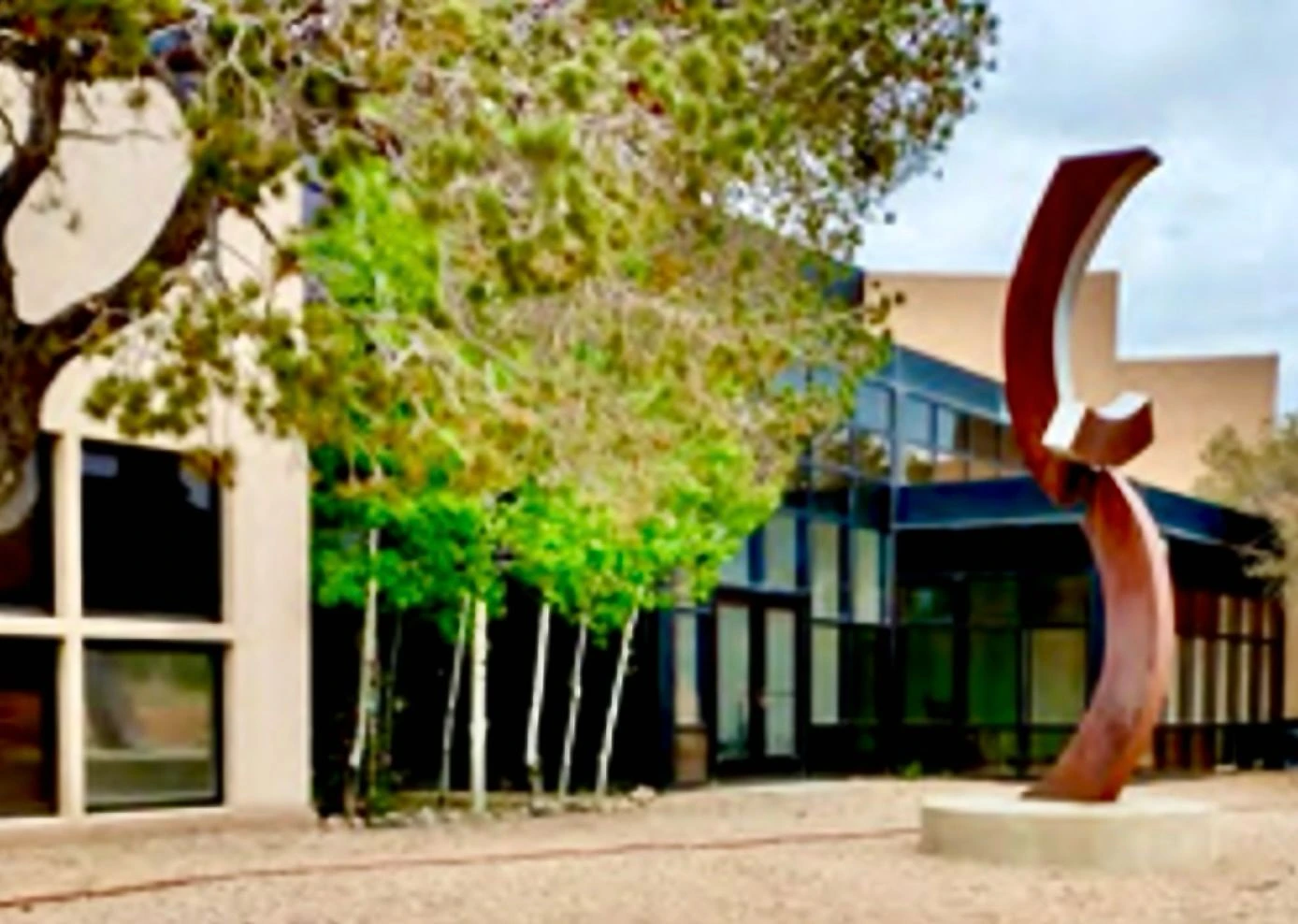 Red sculpture at Multedo Campus building exterior