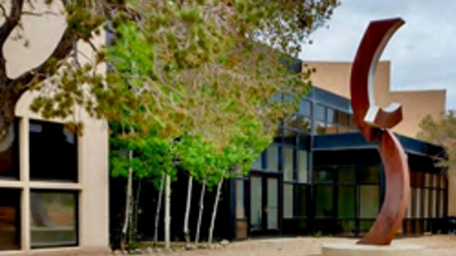 Multedo Campus building exterior with red sculpture
