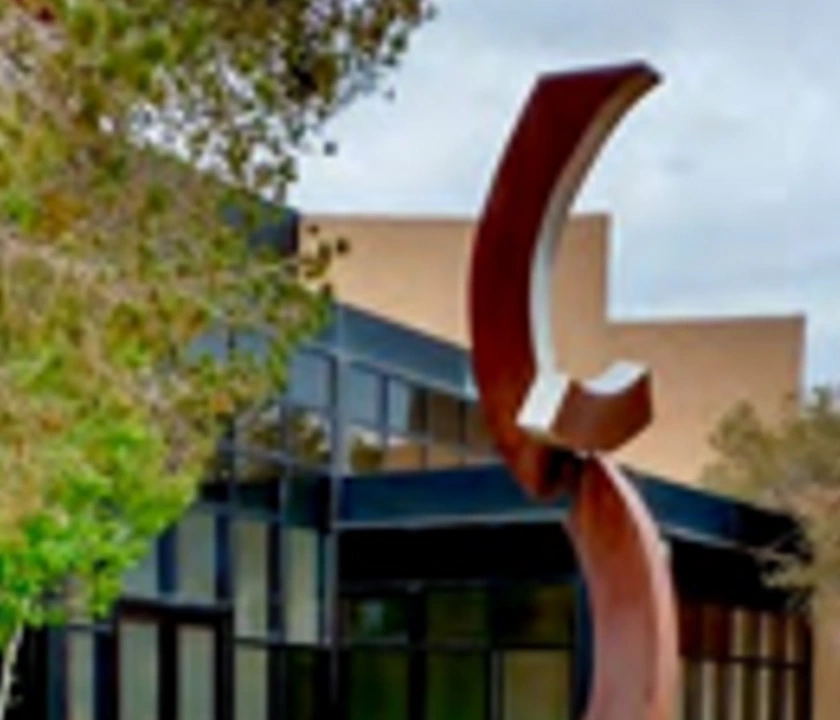Red sculpture at Multedo Campus building exterior